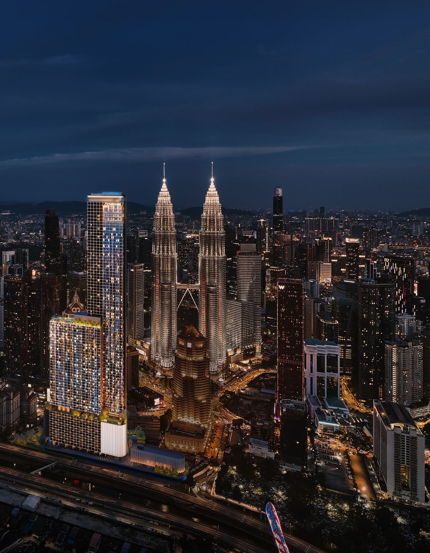 DIVINE KL City Centre, Kuala Lumpur: artist's impression of the tower at night beside the Petronas Twin Towers